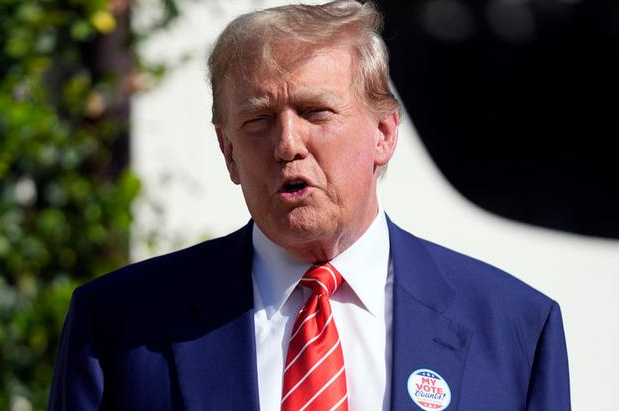 Presidential candidate Donald Trump gets a golf trophy at his Palm Beach course