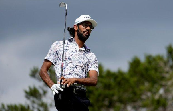 Bhatia overcame a shoulder injury to take a 4-shot lead at the Texas O ...